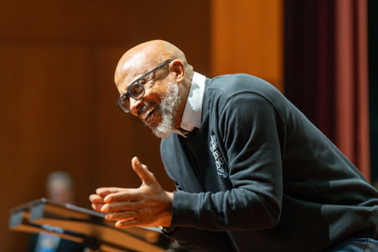 Kevin Phillip Johnson sharing a moment of joy while leading singers